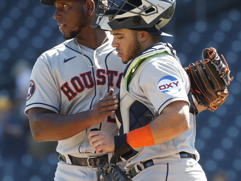 Apr 12, 2023; Pittsburgh, Pennsylvania, USA;  Houston Astros relief pitcher Ronel Blanco (56) and catcher Yainer Diaz (21) celebrate after defeating the Pittsburgh Pirates at PNC Park. The Astros shutout the Pirates 7-0. Mandatory Credit: Charles LeClaire-USA TODAY Sports