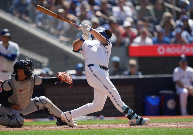 Jun 15, 2024; Toronto, Ontario, CAN; Toronto Blue Jays second baseman Spencer Horwitz (48) has an RBI single against the Cleveland Guardians during the second inning at Rogers Centre. Mandatory Credit: Nick Turchiaro-USA TODAY Sports