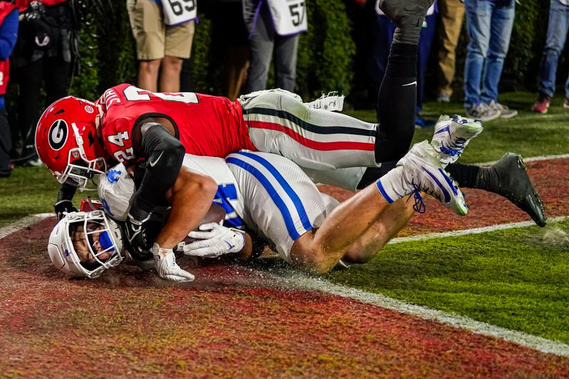 Oct 7, 2023; Athens, Georgia, USA; Kentucky Wildcats tight end Josh Kattus (84) catches a touchdown pass against Georgia Bulldogs defensive back Malaki Starks (24) during the first half at Sanford Stadium. Mandatory Credit: Dale Zanine-USA TODAY Sports