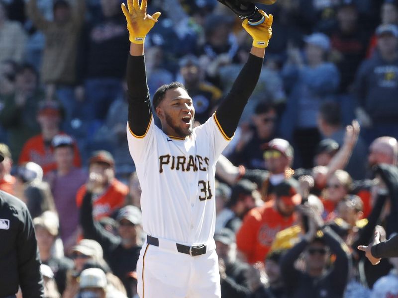 Apr 7, 2024; Pittsburgh, Pennsylvania, USA;  Pittsburgh Pirates designated hitter Edward Olivares (38) reacts after driving in the game winning runs against the Baltimore Orioles during the ninth inning at PNC Park. Mandatory Credit: Charles LeClaire-USA TODAY Sports