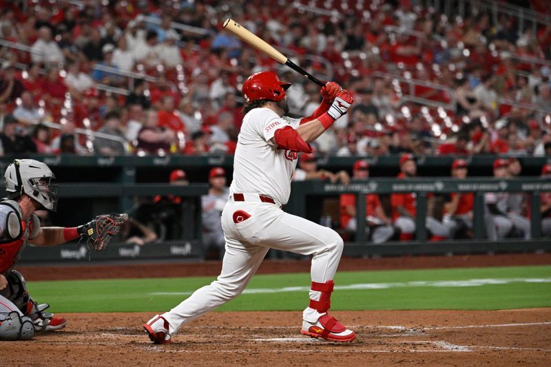 Sep 15, 2025; St. Louis, Missouri, USA; St. Louis Cardinals left fielder Alec Burleson (41) hits a two-run double against the Cincinnati Reds in the sixth inning at Busch Stadium. Mandatory Credit: Joe Puetz-Imagn Images