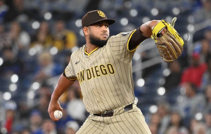 May 21, 2025; Toronto, Ontario, CAN;  San Diego Padres starting pitcher Randy Vasquez (98) delivers a pitch against the Toronto Blue Jays in the first inning at Rogers Centre. Mandatory Credit: Dan Hamilton-Imagn Images