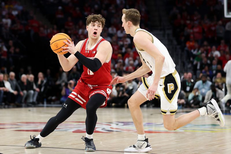 Mar 16, 2024; Minneapolis, MN, USA; Wisconsin Badgers guard Max Klesmit (11) works around Purdue Boilermakers guard Fletcher Loyer (2) during the second half at Target Center. Mandatory Credit: Matt Krohn-USA TODAY Sports