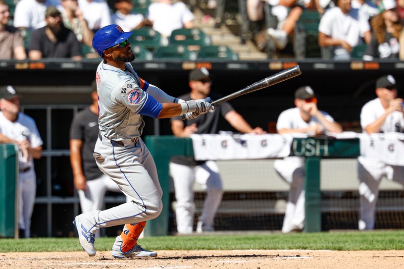 Sep 1, 2024; Chicago, Illinois, USA; New York Mets outfielder Starling Marte (6) hits an RBI-double against the Chicago White Sox during the ninth inning at Guaranteed Rate Field. Mandatory Credit: Kamil Krzaczynski-USA TODAY Sports