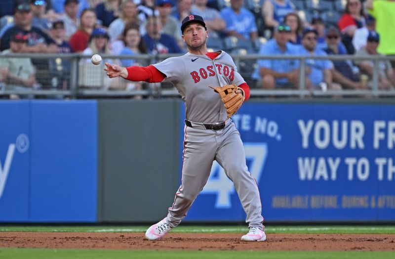 May 10, 2025; Kansas City, Missouri, USA;  Boston Red Sox third baseman Alex Bregman (2) throws to first base in the first inning against the Kansas City Royals at Kauffman Stadium. Mandatory Credit: Peter Aiken-Imagn Images