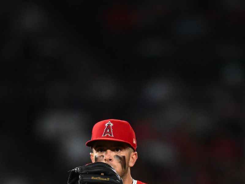 Aug 17, 2024; Anaheim, California, USA; Los Angeles Angels shortstop Zach Neto (9) makes a catch against the Atlanta Braves during the seventh inning at Angel Stadium. Mandatory Credit: Jonathan Hui-USA TODAY Sports