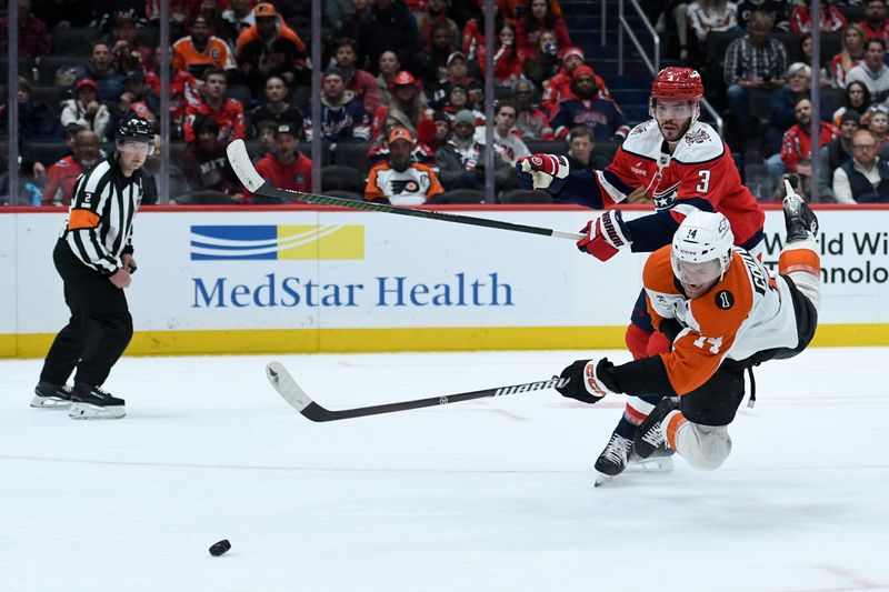 Feb 25, 2026; Washington, District of Columbia, USA; Philadelphia Flyers center Sean Couturier (14) shoots the puck defended by Washington Capitals defenseman Matt Roy (3) during the second period at Capital One Arena. Mandatory Credit: Hannah Foslien-Imagn Images