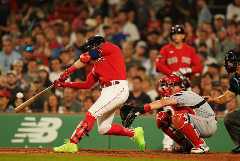 Jun 1, 2023; Boston, Massachusetts, USA; Boston Red Sox shortstop Enrique Hernandez (5) hits a home run against the Cincinnati Reds in the seventh inning at Fenway Park. Mandatory Credit: David Butler II-USA TODAY Sports