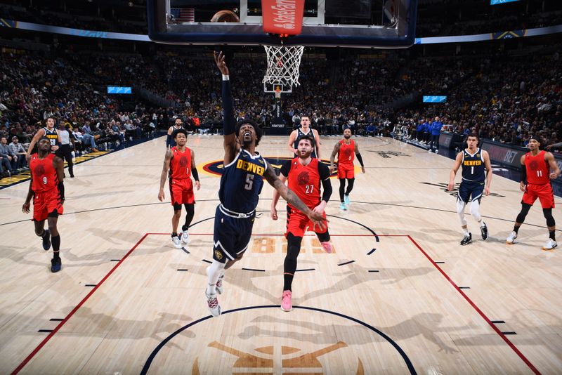 DENVER, CO - JANUARY 17: Kentavious Caldwell-Pope #5 of the Denver Nuggets drives to the basket during the game against the Portland Trail Blazers on January 17, 2023 at the Ball Arena in Denver, Colorado. NOTE TO USER: User expressly acknowledges and agrees that, by downloading and/or using this Photograph, user is consenting to the terms and conditions of the Getty Images License Agreement. Mandatory Copyright Notice: Copyright 2023 NBAE (Photo by Garrett Ellwood/NBAE via Getty Images)