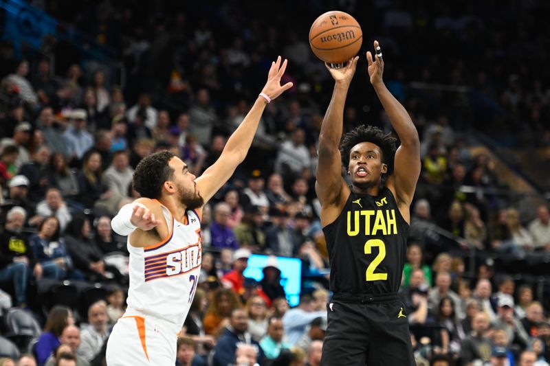 SALT LAKE CITY, UTAH - NOVEMBER 12: Collin Sexton #2 of the Utah Jazz shoots over Tyus Jones #21 of the Phoenix Suns during the first half of a Emirates NBA Cup game at Delta Center on November 12, 2024 in Salt Lake City, Utah. NOTE TO USER: User expressly acknowledges and agrees that, by downloading and or using this photograph, User is consenting to the terms and conditions of the Getty Images License Agreement. (Photo by Alex Goodlett/Getty Images)