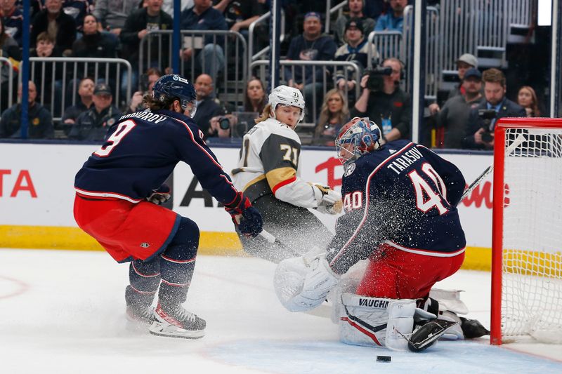 Mar 4, 2024; Columbus, Ohio, USA; Columbus Blue Jackets goalie Daniil Tarasov (40) stops the shot attempt of Vegas Golden Knights center William Karlsson (71) during the first period at Nationwide Arena. Mandatory Credit: Russell LaBounty-USA TODAY Sports