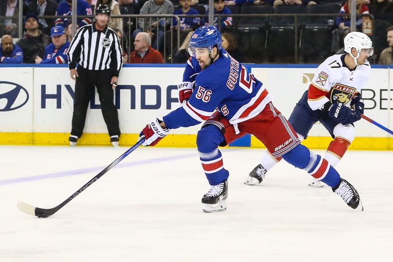 Mar 4, 2024; New York, New York, USA;  New York Rangers defenseman Erik Gustafsson (56) controls the puck in the first period against the Florida Panthers at Madison Square Garden. Mandatory Credit: Wendell Cruz-USA TODAY Sports