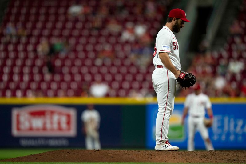 Sep 6, 2023; Cincinnati, Ohio, USA; Cincinnati Reds relief pitcher Sam Moll (50) prepares to pitch in the sixth inning of the MLB baseball game between the Cincinnati Reds and the Seattle Mariners at Great American Ball Park. Mandatory Credit: Albert Cesare-USA TODAY Sports