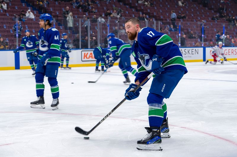 Vancouver Canucks' Brock Boeser Leads Charge Against New York Rangers in NHL Showdown