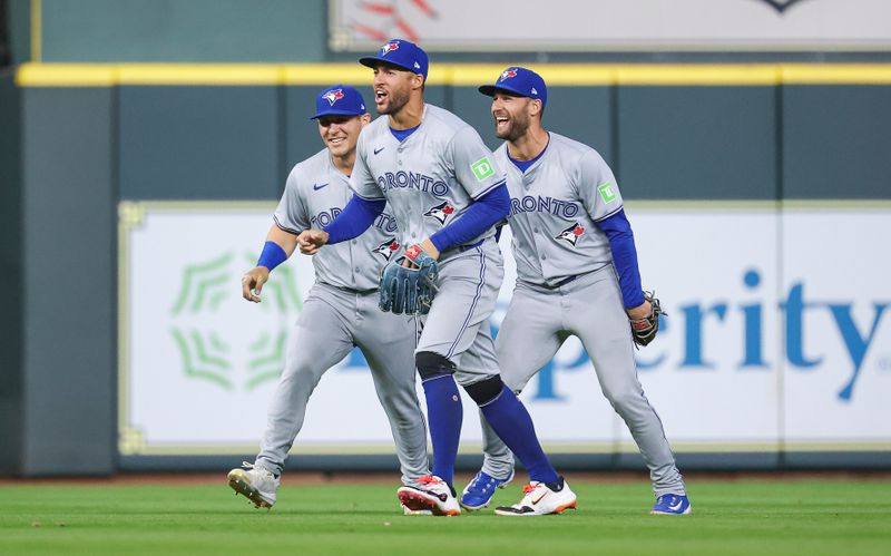 Apr 2, 2024; Houston, Texas, USA; Toronto Blue Jays right fielder George Springer (4) and left fielder Daulton Varsho (25) and center fielder Kevin Kiermaier (39) celebrate after the game against the Houston Astros at Minute Maid Park. Mandatory Credit: Troy Taormina-USA TODAY Sports