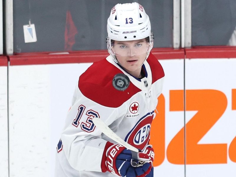 Dec 14, 2024; Winnipeg, Manitoba, CAN; Montreal Canadiens right wing Cole Caufield (13) puck juggles before a game against the Winnipeg Jets at Canada Life Centre. Mandatory Credit: James Carey Lauder-Imagn Images