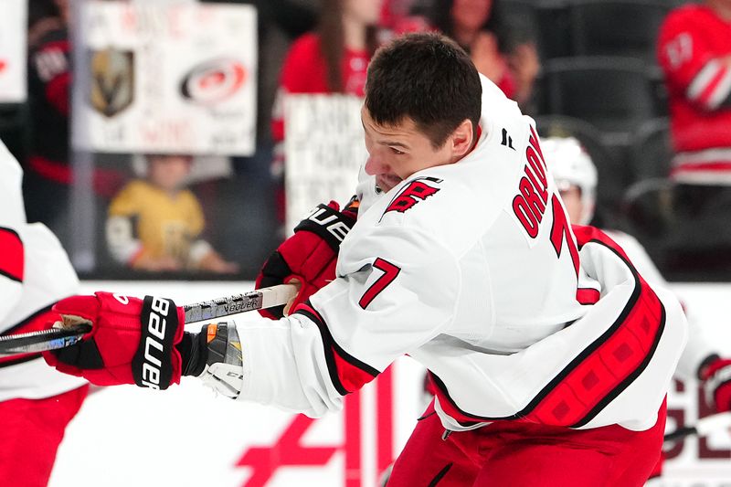 Nov 11, 2024; Las Vegas, Nevada, USA; Carolina Hurricanes defenseman Dmitry Orlov (7) warms up before a game against the Vegas Golden Knights at T-Mobile Arena. Mandatory Credit: Stephen R. Sylvanie-Imagn Images