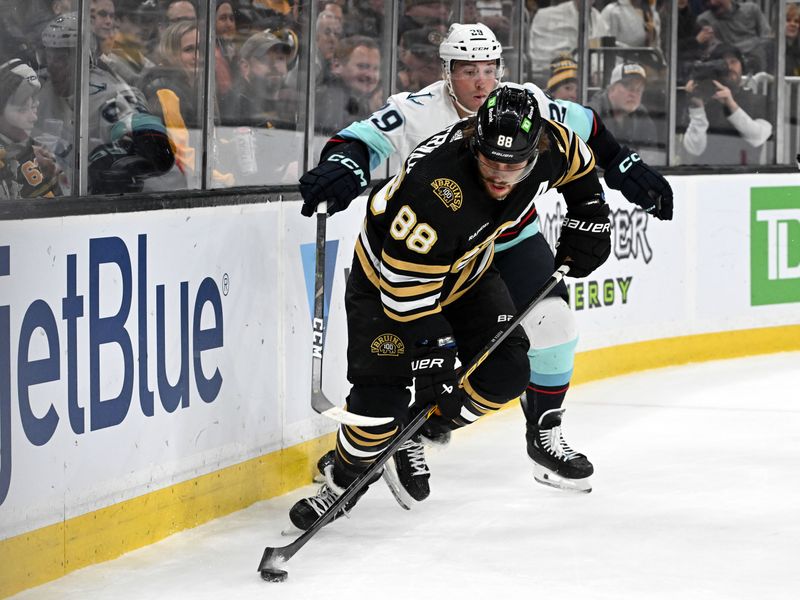 Feb 15, 2024; Boston, Massachusetts, USA; Boston Bruins right wing David Pastrnak (88) controls the puck against Seattle Kraken defenseman Vince Dunn #29 during the first period at TD Garden. Mandatory Credit: Brian Fluharty-USA TODAY Sports