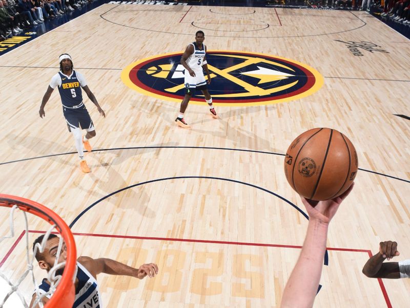 DENVER, CO - APRIL 10: Nikola Jokic #15 of the Denver Nuggets grabs a rebound during the game against the Minnesota Timberwolves on April 10, 2024 at the Ball Arena in Denver, Colorado. NOTE TO USER: User expressly acknowledges and agrees that, by downloading and/or using this Photograph, user is consenting to the terms and conditions of the Getty Images License Agreement. Mandatory Copyright Notice: Copyright 2024 NBAE (Photo by Garrett Ellwood/NBAE via Getty Images)