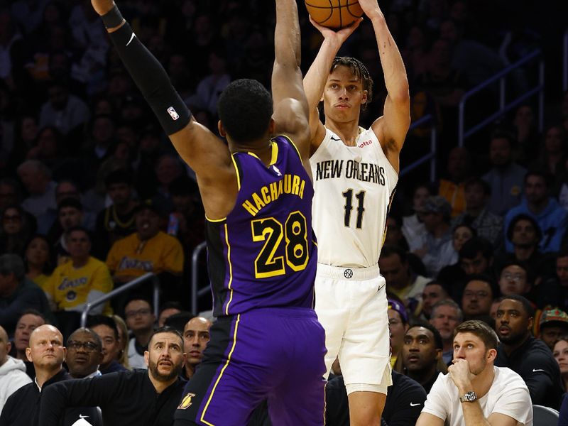 LOS ANGELES, CALIFORNIA - FEBRUARY 09:  Dyson Daniels #11 of the New Orleans Pelicans takes a shot against Rui Hachimura #28 of the Los Angeles Lakers in the second half at Crypto.com Arena on February 09, 2024 in Los Angeles, California.  NOTE TO USER: User expressly acknowledges and agrees that, by downloading and/or using this photograph, user is consenting to the terms and conditions of the Getty Images License Agreement.  (Photo by Ronald Martinez/Getty Images)