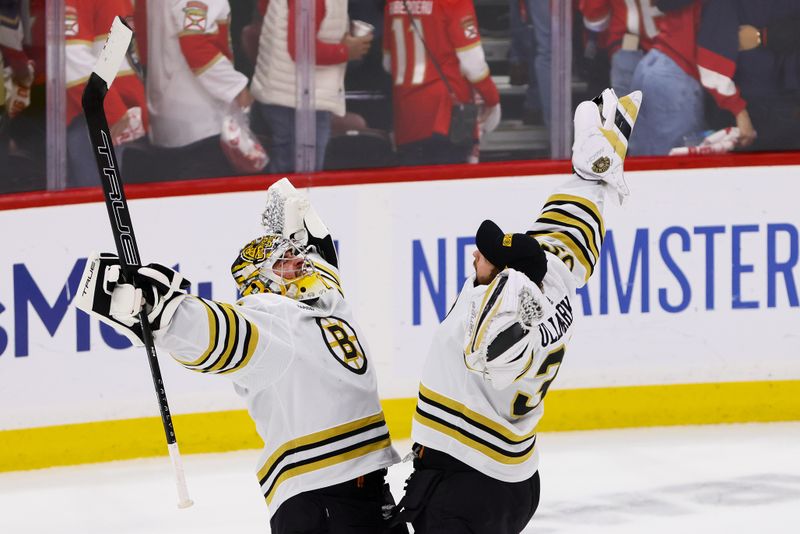 May 14, 2024; Sunrise, Florida, USA; Boston Bruins goaltender Jeremy Swayman (1) and goaltender Linus Ullmark (35) celebrate after winning against the Florida Panthers in game five of the second round of the 2024 Stanley Cup Playoffs at Amerant Bank Arena. Mandatory Credit: Sam Navarro-USA TODAY Sports