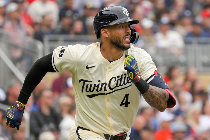 May 26, 2024; Minneapolis, Minnesota, USA;  Minnesota Twins infielder Carlos Correa (4) heads to first on an eventual RBI double against the Texas Rangers during the sixth inning at Target Field. Mandatory Credit: Nick Wosika-USA TODAY Sports