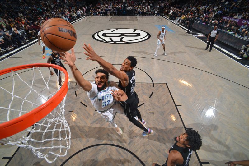 BROOKLYN, NY - JANUARY 25: Karl-Anthony Towns #32 of the Minnesota Timberwolves drives to the basket during the game against the Brooklyn Nets on January 25, 2024 at Barclays Center in Brooklyn, New York. NOTE TO USER: User expressly acknowledges and agrees that, by downloading and or using this Photograph, user is consenting to the terms and conditions of the Getty Images License Agreement. Mandatory Copyright Notice: Copyright 2024 NBAE (Photo by Jesse D. Garrabrant/NBAE via Getty Images)