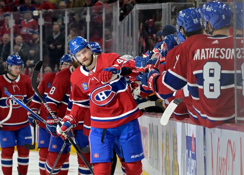 Feb 11, 2024; Montreal, Quebec, CAN; Montreal Canadiens forward Joel Armia (40) celebrates with teammates after scoring a goal against the St.Louis Blues during the third period at the Bell Centre. Mandatory Credit: Eric Bolte-USA TODAY Sports