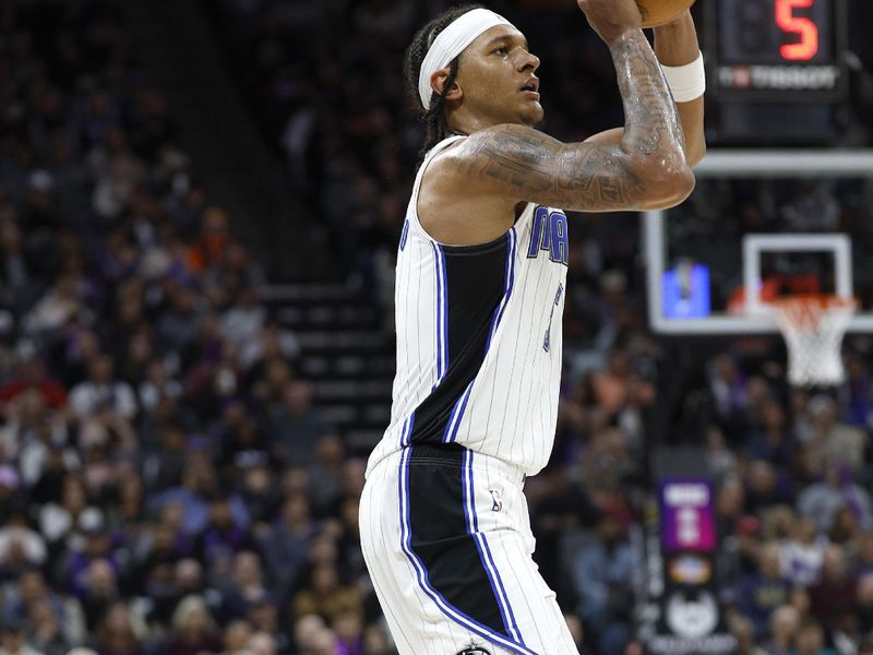 SACRAMENTO, CALIFORNIA - JANUARY 03: Paolo Banchero #5 of the Orlando Magic shoots a three-point shot against the Sacramento Kings during the second half of an NBA basketball game at Golden 1 Center on January 03, 2024 in Sacramento, California. NOTE TO USER: User expressly acknowledges and agrees that, by downloading and or using this photograph, User is consenting to the terms and conditions of the Getty Images License Agreement. (Photo by Thearon W. Henderson/Getty Images)