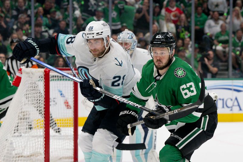 May 15, 2023; Dallas, Texas, USA; Seattle Kraken defenseman Carson Soucy (28) and Dallas Stars right wing Evgenii Dadonov (63) look for the puck in the Seattle zone during the second period in game seven of the second round of the 2023 Stanley Cup Playoffs at the American Airlines Center. Mandatory Credit: Jerome Miron-USA TODAY Sports