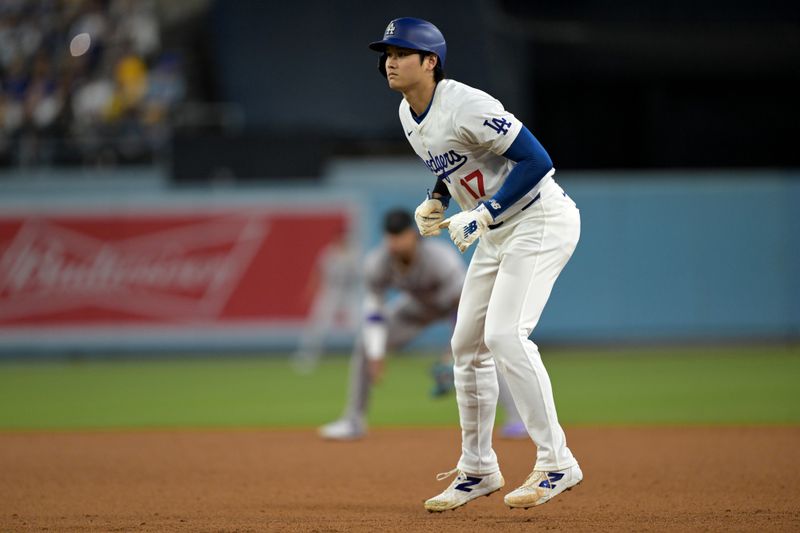 May 20, 2024; Los Angeles, California, USA;  Los Angeles Dodgers designated hitter Shohei Ohtani (17) takes a lead off first in the third inning against the Arizona Diamondbacks at Dodger Stadium. Mandatory Credit: Jayne Kamin-Oncea-USA TODAY Sports