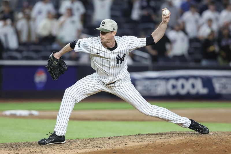 May 18, 2025; Bronx, New York, USA;  New York Yankees relief pitcher Tim Hill (41) pitches in the ninth inning against the New York Mets at Yankee Stadium. Mandatory Credit: Wendell Cruz-Imagn Images