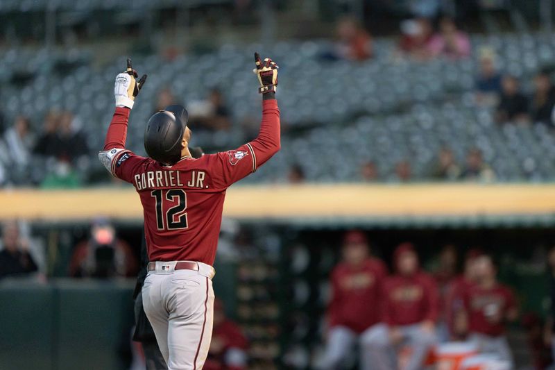 May 16, 2023; Oakland, California, USA; Arizona Diamondbacks left fielder Lourdes Gurriel Jr. (12) celebrates after hitting a home run during the fifth inning against the Oakland Athletics at Oakland-Alameda County Coliseum. Mandatory Credit: Stan Szeto-USA TODAY Sports