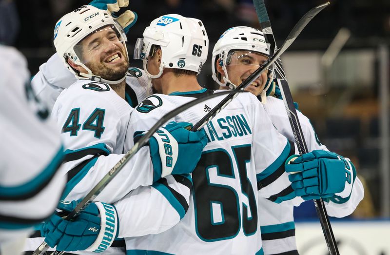 Oct 20, 2022; New York, New York, USA; San Jose Sharks defenseman Erik Karlsson (65) embraces defenseman Marc-Edouard Vlasic (44) after he scored the game-winning goal in overtime against the New York Rangers at Madison Square Garden. Mandatory Credit: Danny Wild-USA TODAY Sports