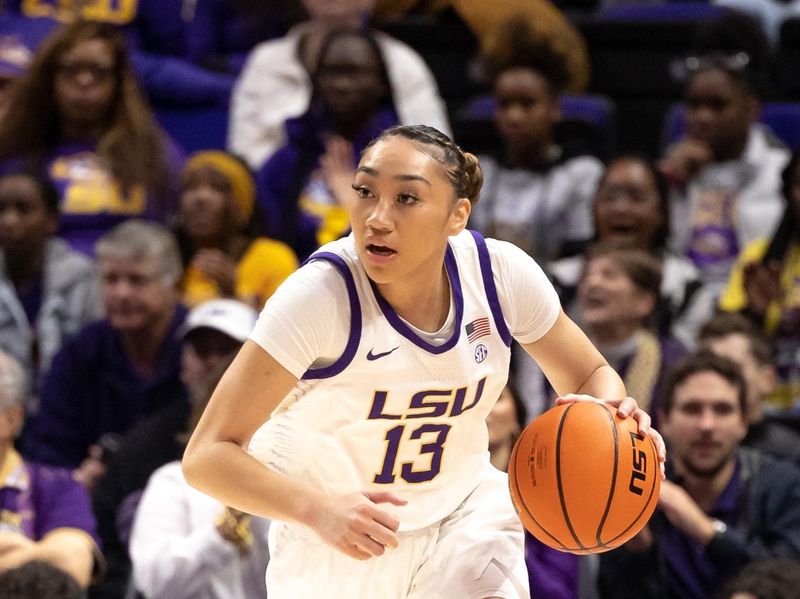 Feb 2, 2023; Baton Rouge, Louisiana, USA; LSU Lady Tigers guard Last-Tear Poa (13) brings the ball up court against the Georgia Lady Bulldogs  during the first half at Pete Maravich Assembly Center. Mandatory Credit: Stephen Lew-USA TODAY Sports