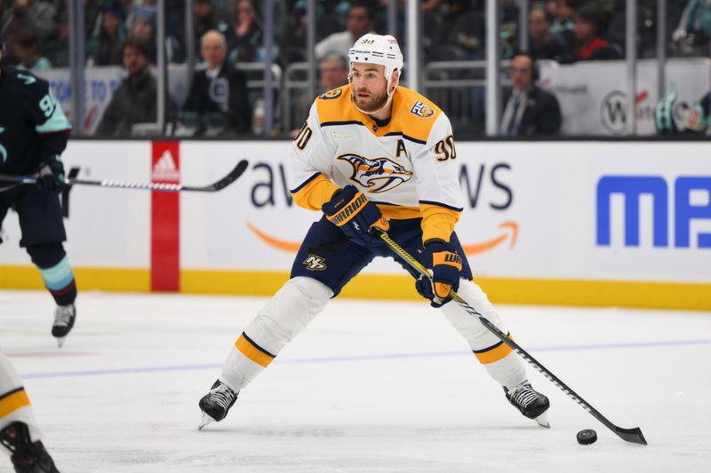 Mar 16, 2024; Seattle, Washington, USA; Nashville Predators center Ryan O'Reilly (90) looks to pass the puck against the Seattle Kraken during the second period at Climate Pledge Arena. Mandatory Credit: Steven Bisig-USA TODAY Sports