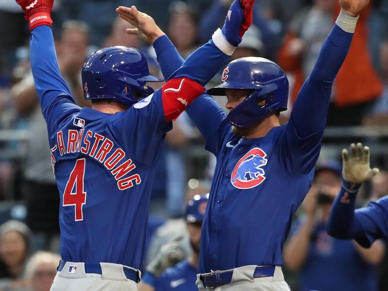 Apr 29, 2025; Pittsburgh, Pennsylvania, USA;  Chicago Cubs second baseman Nico Hoerner (right) congratulates center fielder Pete Crow-Armstrong (4) crossing home plate on a two run home run against the Pittsburgh Pirates during the fifth inning at PNC Park. Mandatory Credit: Charles LeClaire-Imagn Images