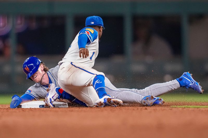 Apr 8, 2024; Cumberland, Georgia, USA; New York Mets third baseman Brett Baty (22) is safe at second base under Atlanta Braves second baseman Ozzie Albies (1) after a wild pitch during the eighth inning at Truist Park. Mandatory Credit: Dale Zanine-USA TODAY Sports