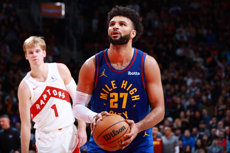 TORONTO, CANADA - OCTOBER 28: Jamal Murray #27 of the Denver Nuggets shoots a free throw during the game against the Toronto Raptors on October 28, 2024 at the Scotiabank Arena in Toronto, Ontario, Canada.  NOTE TO USER: User expressly acknowledges and agrees that, by downloading and or using this Photograph, user is consenting to the terms and conditions of the Getty Images License Agreement.  Mandatory Copyright Notice: Copyright 2024 NBAE (Photo by Vaughn Ridley/NBAE via Getty Images)