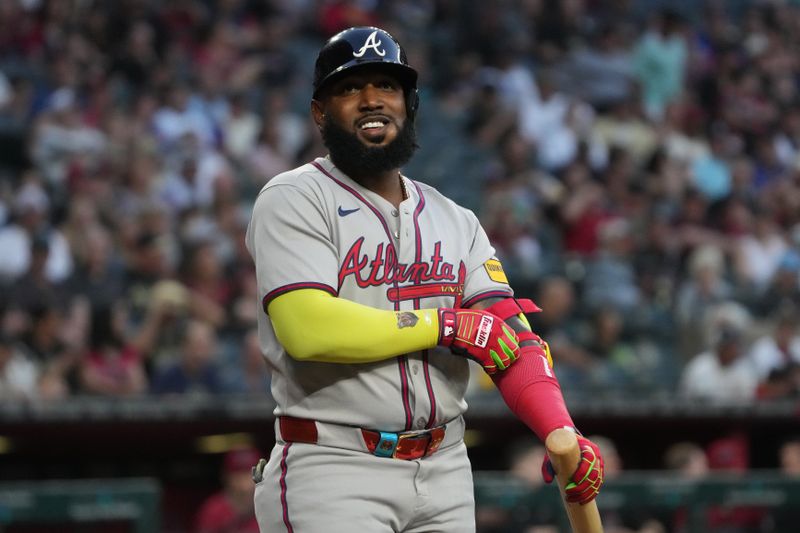 Apr 25, 2025; Phoenix, Arizona, USA; Atlanta Braves designated hitter Marcell Ozuna (20) reacts after getting walked in the first inning against the Arizona Diamondbacks at Chase Field. Mandatory Credit: Rick Scuteri-Imagn Images
