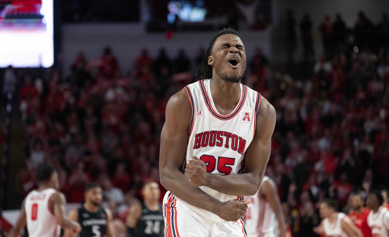 Jan 28, 2023; Houston, Texas, USA; Houston Cougars forward Jarace Walker (25) celebrates his dunk against the Cincinnati Bearcats in the second half at Fertitta Center. Houston Cougars won 75 to 69 .Mandatory Credit: Thomas Shea-USA TODAY Sports