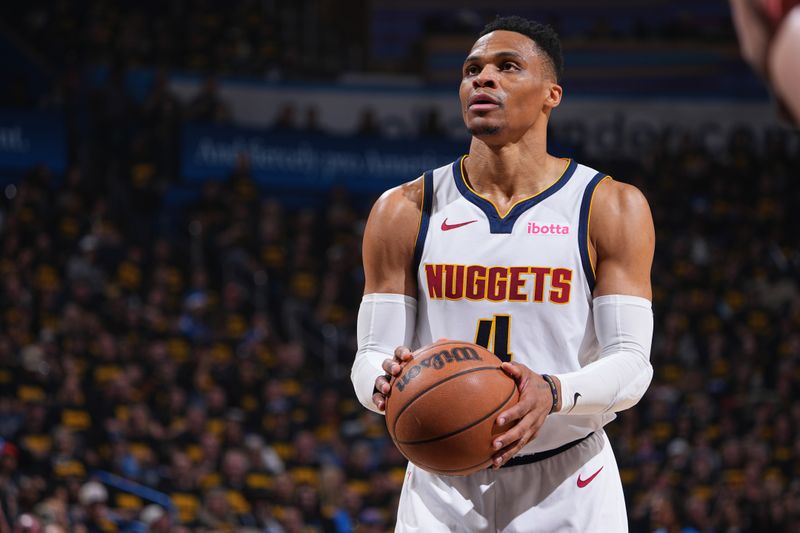 OKLAHOMA CITY, OK - MAY 7:  Russell Westbrook #4 of the Denver Nuggets shoots a free throw during the game against the Oklahoma City Thunder  during Round 2 Game 2 of the  2025 NBA Playoffs  on May 7, 2025 at Paycom Center in Oklahoma City, Oklahoma. NOTE TO USER: User expressly acknowledges and agrees that, by downloading and or using this photograph, User is consenting to the terms and conditions of the Getty Images License Agreement. Mandatory Copyright Notice: Copyright 2025 NBAE (Photo by Garrett Ellwood/NBAE via Getty Images)