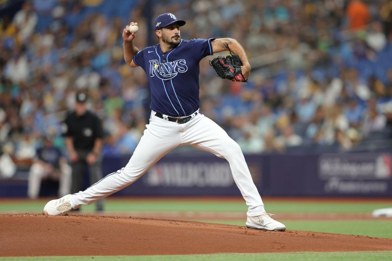 Oct 4, 2023; St. Petersburg, Florida, USA; Tampa Bay Rays starting pitcher Zach Eflin (24) pitches against the Texas Rangers in the first inning during game two of the Wildcard series for the 2023 MLB playoffs at Tropicana Field. Mandatory Credit: Nathan Ray Seebeck-USA TODAY Sports