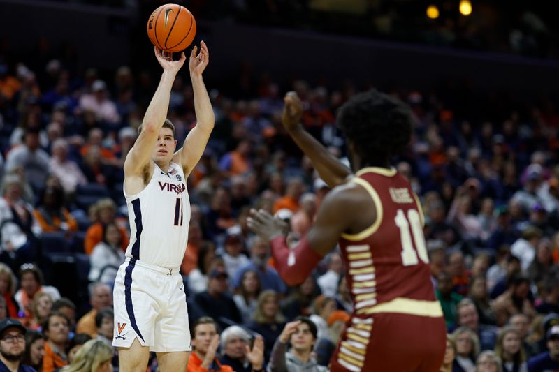 Jan 28, 2023; Charlottesville, Virginia, USA; Virginia Cavaliers guard Isaac McKneely (11) shoots the ball over Boston College Eagles guard Prince Aligbe (10) in the second half at John Paul Jones Arena. Mandatory Credit: Geoff Burke-USA TODAY Sports