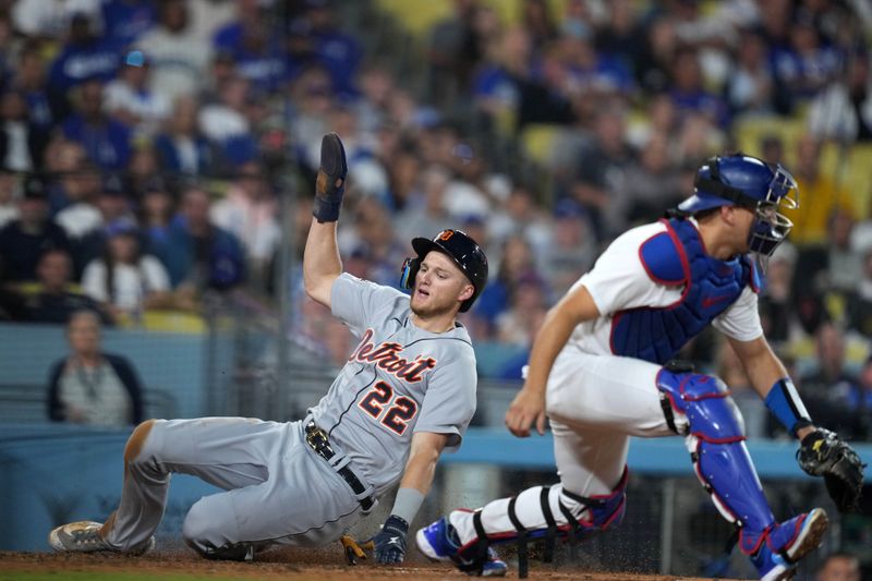 Sep 20, 2023; Los Angeles, California, USA; Detroit Tigers center fielder Parker Meadows (22) slides into home plate to score to beat a throw to Los Angeles Dodgers catcher Austin Barnes (15) to score in the seventh inning at Dodger Stadium. Mandatory Credit: Kirby Lee-USA TODAY Sports