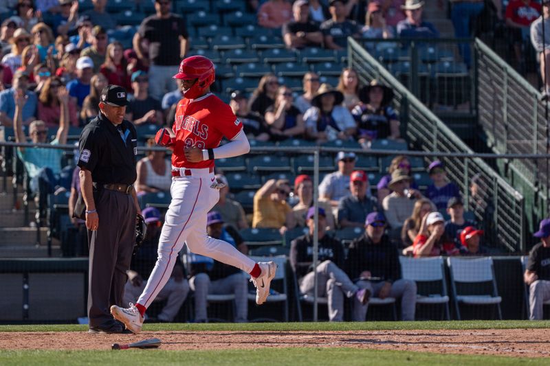 Mar 8, 2024; Tempe, Arizona, USA; Los Angeles Angels outfielder Jordyn Adams (39) score in the ninth after a single by infielder Sam Brown (47) (not shown) during a spring training game against the Colorado Rockies at Tempe Diablo Stadium. Mandatory Credit: Allan Henry-USA TODAY Sports