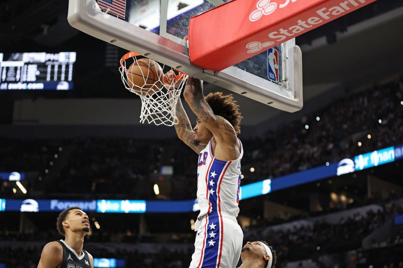 SAN ANTONIO, TX - APRIL 7: Kelly Oubre Jr. #9 of the Philadelphia 76ers dunks the ball during the game against the San Antonio Spurs on April 7, 2024 at the Frost Bank Center in San Antonio, Texas. NOTE TO USER: User expressly acknowledges and agrees that, by downloading and or using this photograph, user is consenting to the terms and conditions of the Getty Images License Agreement. Mandatory Copyright Notice: Copyright 2024 NBAE (Photos by Tim Heitman/NBAE via Getty Images)