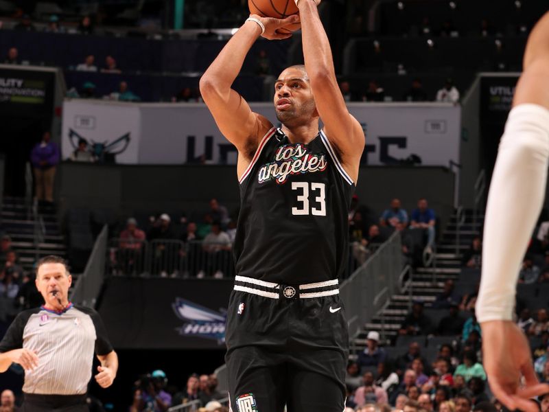 CHARLOTTE, NC - DECEMBER 5: Nicolas Batum #33 of the LA Clippers shoots a three point basket during the game against the Charlotte Hornets on December 5, 2022 at Spectrum Center in Charlotte, North Carolina. NOTE TO USER: User expressly acknowledges and agrees that, by downloading and or using this photograph, User is consenting to the terms and conditions of the Getty Images License Agreement. Mandatory Copyright Notice: Copyright 2022 NBAE (Photo by Kent Smith/NBAE via Getty Images)