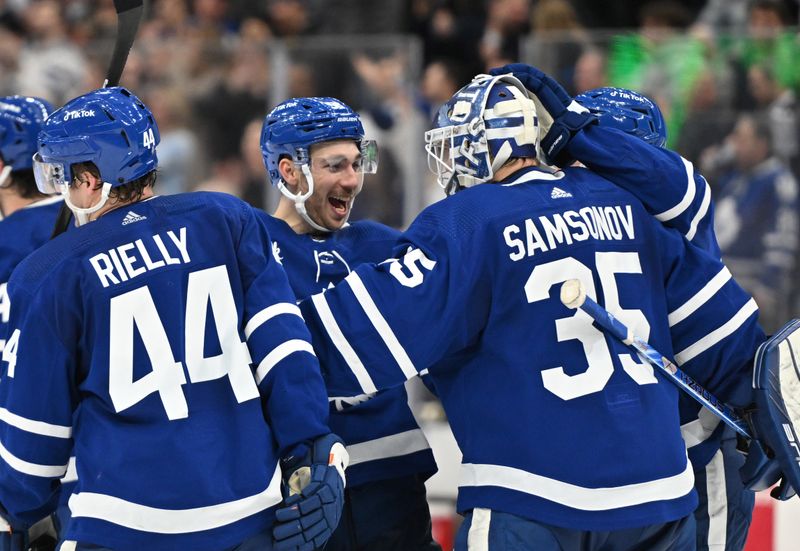 Jan 17, 2023; Toronto, Ontario, CAN;  Toronto Maple Leafs forward Michael Bunting (center) greets goalie Ilya Samsonov (35) after an overtime win over the Florida Panthers at Scotiabank Arena. Mandatory Credit: Dan Hamilton-USA TODAY Sports