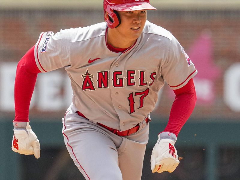 Aug 2, 2023; Cumberland, Georgia, USA; Los Angeles Angels designated hitter Shohei Ohtani (17) runs to third base against the Atlanta Braves during the eighth inning at Truist Park. Mandatory Credit: Dale Zanine-USA TODAY Sports